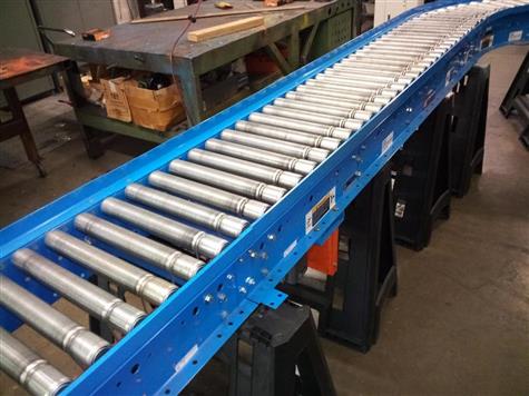 ROACH Powered Roller Conveyor with 90 Degree Curve | Roller Conveyor